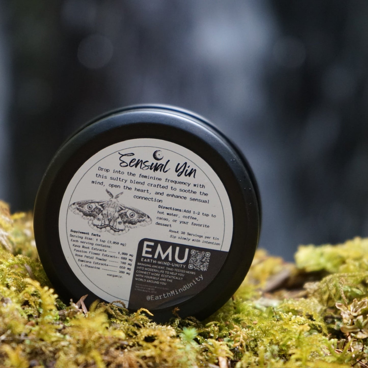 Tin labeled 'Sensual Yin' with nutrition label on a mossy surface